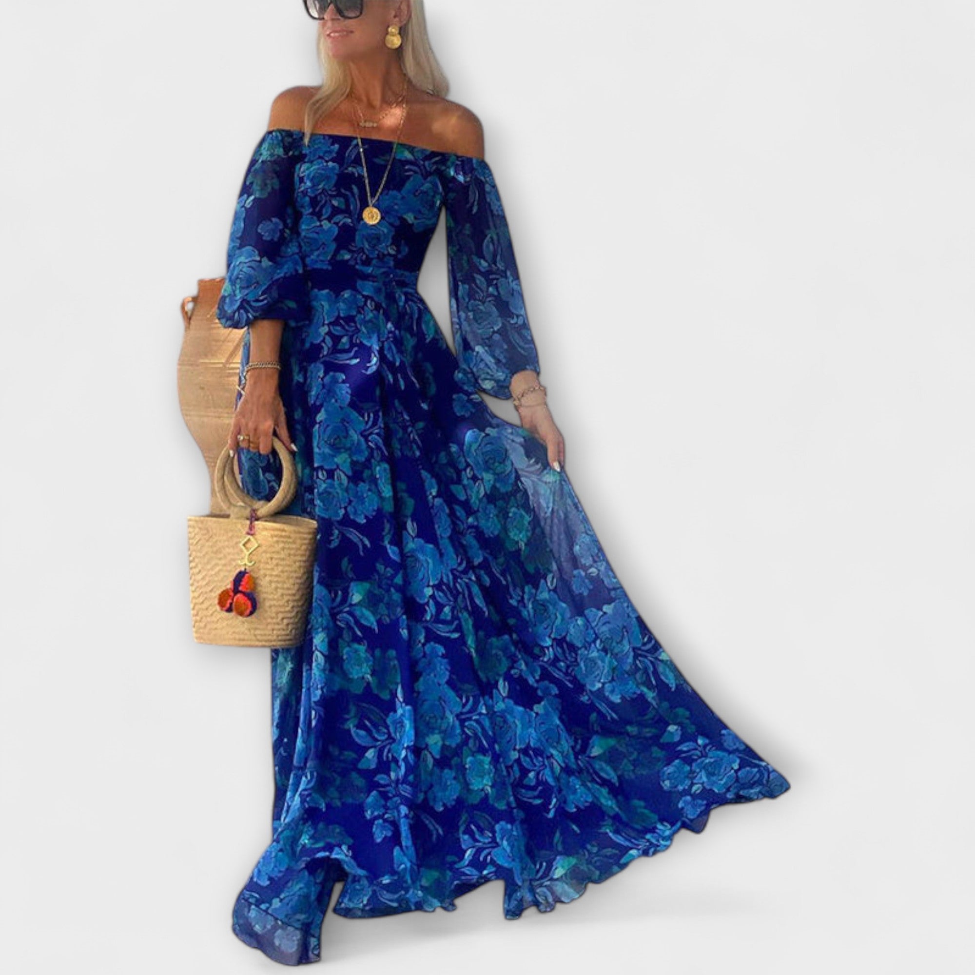 Velora | Maxi šaty s květinovým vzorem a odhalenými rameny.